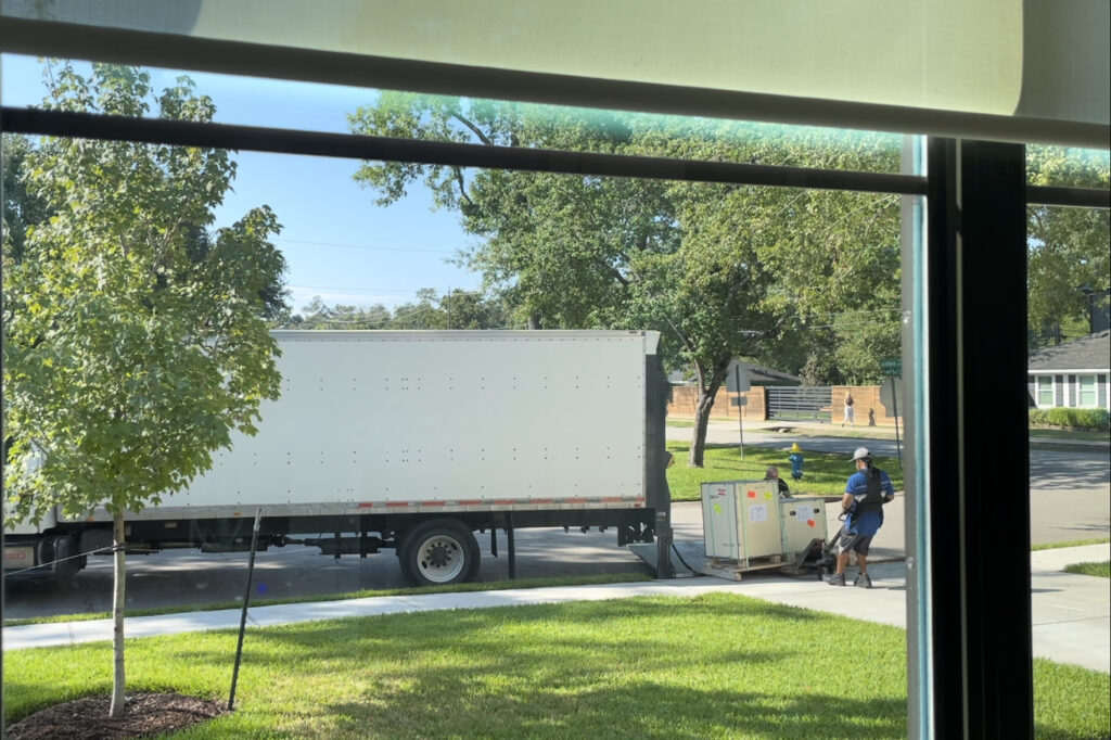 It has arrived! The local freight company delivering my new Cade 600 S2 reef tank to my house.